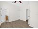 Spacious bedroom with wood-look flooring, and access to a bathroom at 13758 Daniels Landing Cir, Winter Garden, FL 34787