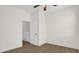 A bedroom with wood-look flooring and a white paneled door at 13758 Daniels Landing Cir, Winter Garden, FL 34787