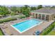 Inviting community pool with ample lounge seating and a covered pavilion at 13758 Daniels Landing Cir, Winter Garden, FL 34787