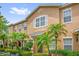 Inviting exterior showing the front of the home, enhanced by beautiful landscaping and ample windows for natural light at 13758 Daniels Landing Cir, Winter Garden, FL 34787