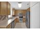 Bright kitchen with stainless steel appliances, light wood cabinets, and ample counter space at 13758 Daniels Landing Cir, Winter Garden, FL 34787