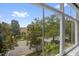 Exterior view from the window, showing the street and trees at 13758 Daniels Landing Cir, Winter Garden, FL 34787