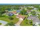 Aerial view of a home in a residential neighborhood with well-manicured lawns and lush landscaping at 14091 Sw 32Nd Terrace Rd, Ocala, FL 34473