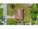 Aerial view of the home featuring a brown roof and well-maintained lawn and landscaping at 14091 Sw 32Nd Terrace Rd, Ocala, FL 34473