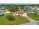 Aerial view of a home with well-maintained lawn and landscaping in a residential neighborhood at 14091 Sw 32Nd Terrace Rd, Ocala, FL 34473