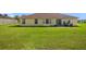 A well-kept backyard featuring a lush green lawn, perfect for outdoor activities at 14091 Sw 32Nd Terrace Rd, Ocala, FL 34473