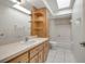 Bright bathroom with natural light features a vanity with storage and a shower-tub combo at 14091 Sw 32Nd Terrace Rd, Ocala, FL 34473