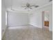 Spacious bedroom features tray ceiling, fan, closet, and adjoined bathroom, creating comfortable, private space at 14091 Sw 32Nd Terrace Rd, Ocala, FL 34473