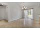 Dining area featuring sliding glass door and stylish chandelier at 14091 Sw 32Nd Terrace Rd, Ocala, FL 34473