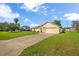 A bright single-Gathering home with a driveway and a well-manicured front lawn at 14091 Sw 32Nd Terrace Rd, Ocala, FL 34473