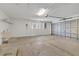 Spacious garage with sink, shelving and large metal door offers plenty of storage space at 14091 Sw 32Nd Terrace Rd, Ocala, FL 34473