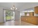 Open-concept living space with sliding glass doors to the backyard and an eat-in kitchen at 14091 Sw 32Nd Terrace Rd, Ocala, FL 34473