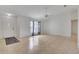 Open living room with neutral flooring, fan, and natural light at 14091 Sw 32Nd Terrace Rd, Ocala, FL 34473