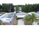 Bird's-eye view of a well-kept home with a covered carport, set in a picturesque community with mature trees at 143 Piedmont Park Ave, Davenport, FL 33897