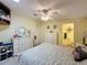 Bedroom featuring bright light, a ceiling fan, and en-suite bathroom at 143 Piedmont Park Ave, Davenport, FL 33897
