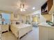 A lovely bedroom with a ceiling fan, view of the closet, and multiple dressers for storage at 143 Piedmont Park Ave, Davenport, FL 33897