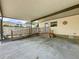 Covered carport featuring a wheelchair ramp that leads to the home's back entrance at 143 Piedmont Park Ave, Davenport, FL 33897