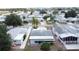 Expansive aerial view showcases the community's serene atmosphere, tree-lined streets, and well-spaced homes at 143 Piedmont Park Ave, Davenport, FL 33897