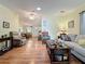 Comfortable living room showing an open floor plan with views into the dining area and kitchen at 143 Piedmont Park Ave, Davenport, FL 33897