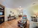 An open living room area with a view to the fireplace, ceiling fan, and a combined dining area at 143 Piedmont Park Ave, Davenport, FL 33897