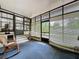 Enclosed sunroom with black trim windows and glass doors leading outside at 143 Piedmont Park Ave, Davenport, FL 33897