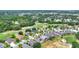 Aerial view of community with homes and golf course at 1560 The Oaks Blvd, Kissimmee, FL 34746
