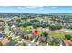 Expansive aerial view of home on golf course with mature trees and beautiful lakes at 1560 The Oaks Blvd, Kissimmee, FL 34746