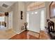 Inviting foyer with hardwood floors, high ceilings and neutral paint scheme at 1560 The Oaks Blvd, Kissimmee, FL 34746