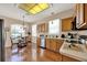 Bright kitchen with stainless steel appliances, wood cabinets, and a sunny breakfast nook at 1560 The Oaks Blvd, Kissimmee, FL 34746