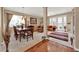 Open floor plan showing living and dining areas with natural light and comfortable seating at 1560 The Oaks Blvd, Kissimmee, FL 34746