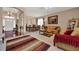 Spacious living room area featuring natural light, comfortable seating and a neutral color palette at 1560 The Oaks Blvd, Kissimmee, FL 34746