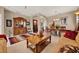 Open-concept living and dining areas offering hardwood floors and elegant furnishings at 1560 The Oaks Blvd, Kissimmee, FL 34746