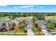 Property outline of a well-maintained home surrounded by lush landscaping at 1560 The Oaks Blvd, Kissimmee, FL 34746