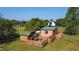 Aerial view featuring observatory with telescope, and a surrounding green lawn at 1850 Orangewood Ave, St Cloud, FL 34772