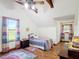 Bright bedroom features charming decor and a cozy feel with hardwood floors and great natural light at 1850 Orangewood Ave, St Cloud, FL 34772