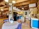 Charming kitchen featuring wooden beam ceilings, a center island, and bright blue accents at 1850 Orangewood Ave, St Cloud, FL 34772