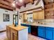 Bright kitchen boasting a wooden island, blue cabinets, and ample counter space at 1850 Orangewood Ave, St Cloud, FL 34772