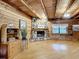 Large living room with a stone fireplace and wood accents, perfect for entertaining guests and enjoying cozy nights in at 1850 Orangewood Ave, St Cloud, FL 34772