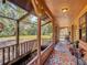 Inviting screened-in porch with water feature and decorative rugs, providing a comfortable outdoor living space at 1850 Orangewood Ave, St Cloud, FL 34772