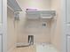 Functional laundry room with washer and dryer hookups and additional storage at 1917 Compass Flower Way, Ocoee, FL 34761