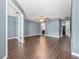 Open living room with hardwood floors and plenty of space for entertaining at 1917 Compass Flower Way, Ocoee, FL 34761
