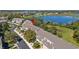 An aerial view shows the property and neighborhood, with a beautiful lake view nearby at 1936 Compass Flower Way, Ocoee, FL 34761