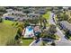 Beautiful aerial view of community pool, manicured landscaping, and clubhouse at 1936 Compass Flower Way, Ocoee, FL 34761