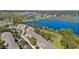 Scenic aerial view of townhomes, pond, and lush green surroundings at 1936 Compass Flower Way, Ocoee, FL 34761