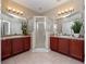 En-suite bathroom with dual sinks, a separate glass-enclosed shower, and modern fixtures at 1936 Compass Flower Way, Ocoee, FL 34761