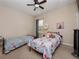 Comfortable bedroom with two beds, perfect for children or guests at 1936 Compass Flower Way, Ocoee, FL 34761