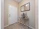 Welcoming entryway featuring tiled floors, a stylish console table, and decorative accents at 1936 Compass Flower Way, Ocoee, FL 34761