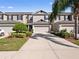 Charming townhouse featuring a well-manicured lawn and a two-car garage, perfect for modern living at 1936 Compass Flower Way, Ocoee, FL 34761