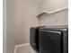 Laundry area with new front-loading washer and dryer units at 1936 Compass Flower Way, Ocoee, FL 34761