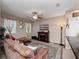 Inviting living room featuring a decorative fireplace, comfortable seating, and stylish decor at 1936 Compass Flower Way, Ocoee, FL 34761